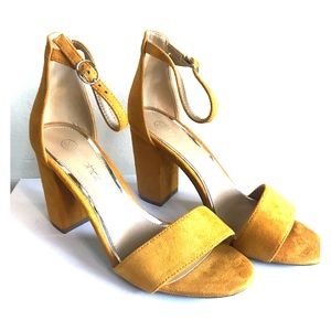 Mustard heeled sandals.